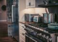 Stylish modern kitchen showcasing stainless steel appliances and elegant decor.