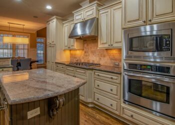 A stylish kitchen featuring stainless steel appliances and luxurious counter space.