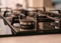 Close-up of a modern stainless steel gas stove top, ideal for contemporary kitchens and cooking environments.