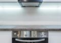 A sleek, modern kitchen with steel appliances and minimalist design.