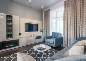 Stylish and modern living room with elegant furniture and decor, creating a cozy atmosphere.