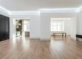 Bright and spacious empty room with wooden flooring, modern design, ideal for interior design inspiration.