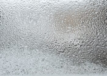 A detailed view of a frosted glass surface, capturing the icy texture and winter ambiance.