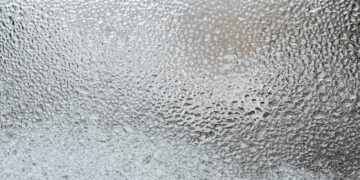A detailed view of a frosted glass surface, capturing the icy texture and winter ambiance.