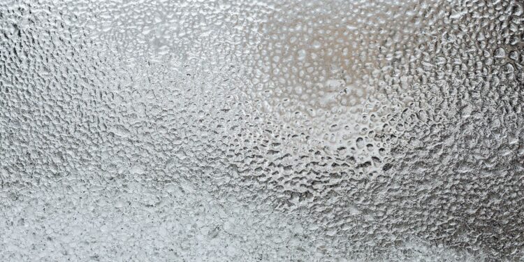 A detailed view of a frosted glass surface, capturing the icy texture and winter ambiance.