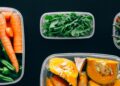 Healthy vegetables stored in plastic containers for fresh and nutritious meals.