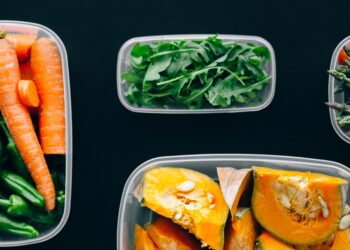 Healthy vegetables stored in plastic containers for fresh and nutritious meals.